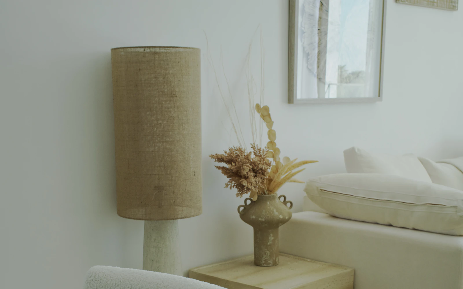 Warm neutral living room with beautifully arranged furniture and decorative accents